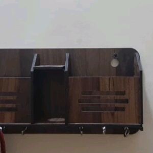 A Good Wooden Key Holder With Phone Holding