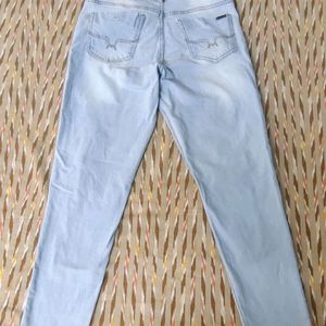 Distressed Blue Jeans With 4 Pockets