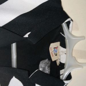 A Fashionable Black And White Blazer Cum Upperwear