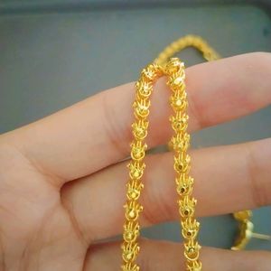 Gold Pleated Jui Motif Tie Chain