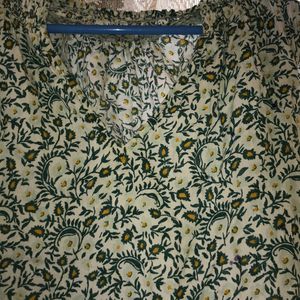 green printed Top with Leavy-flower Print on it.