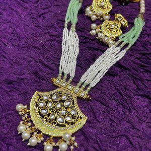 Enduring Charm: Long Pearl Necklace & Earrings Set