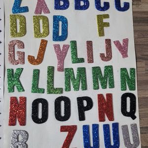 Alphabet Stickers, Feather ,crayons And Erasers