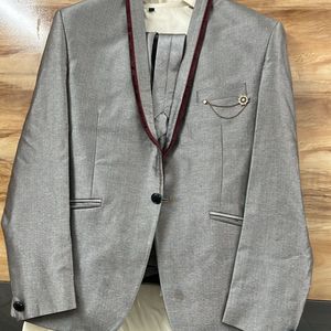 It Is A Full Suit Grey In Colour