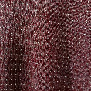 Knit Fabric With Metallic Threads Woven In.