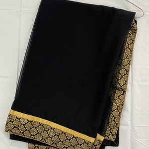 Pretty Black Saree With Golden Border..