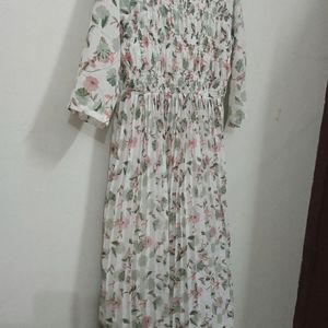 White Colour Printed Frill Type Gown. Eacy To Wear The Front Portion Is Frill Type And White Beeds Work Is Very Beautiful. Frill And Elastic Work So Medium And Xl Type People Can By. .