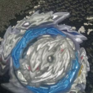 A Metallic Beyblade With Free Bracelet