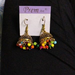 Pair Of 2 Jhumkas One Silver And Golden .