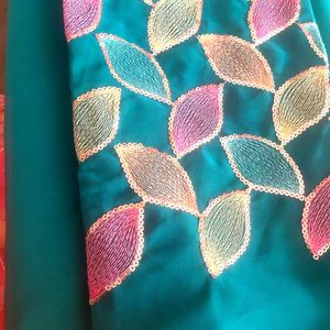 A Beautiful Plain Saree With Designer Blouse