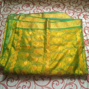 Green Saree with beautiful golden Design