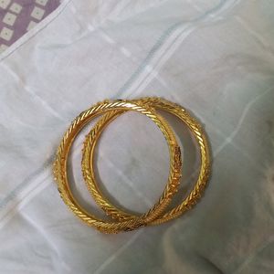 Combo Of Two Golden Bangles, One Bracelet And Kada