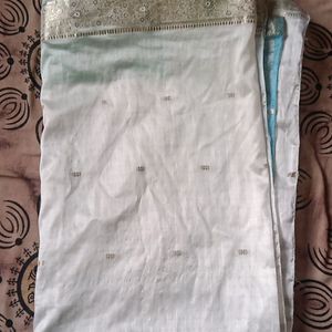 white banarasi silk saree with blue colour pallu