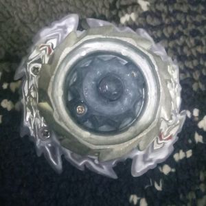 A Metallic Beyblade With Free Bracelet