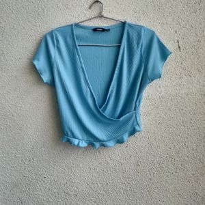 blue wrap cropped top by nuon