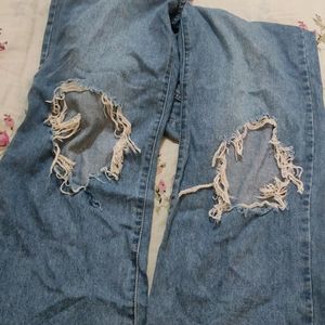Woman's Torn Jeans
