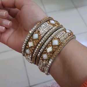 Stone Bangles Of White And Golden Color.