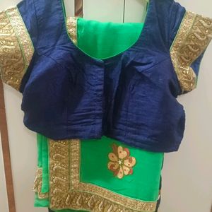 A Green Saree With Navy Blue Border