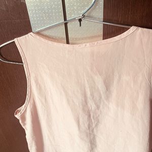 A Peach Colour Top.  Size:M.