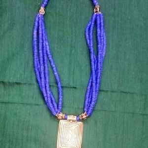 Royal Blue Necklace With Gold Brass Pendant.