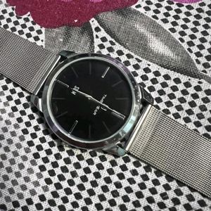 slim metallic watch