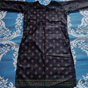 pure cotton black colour long kurta which has red and green printed flowers ..the kurta is unused