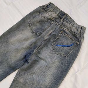 Women High-Rise Heavily Washed Distressed Jean