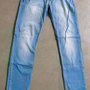 Man Branded Blue Jeans