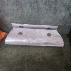 Silver Clutch. There are very few stains over it i