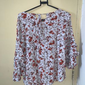 white and orange floral top