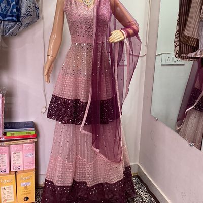RANI PINK LEHENGA SET WITH ALL OVER PATTERNED EMBROIDERY PAIRED WITH A  MATCHING DUPATTA, GOLD AND SILVER HIGHLIGHTS AND TASSELS. - Seasons India