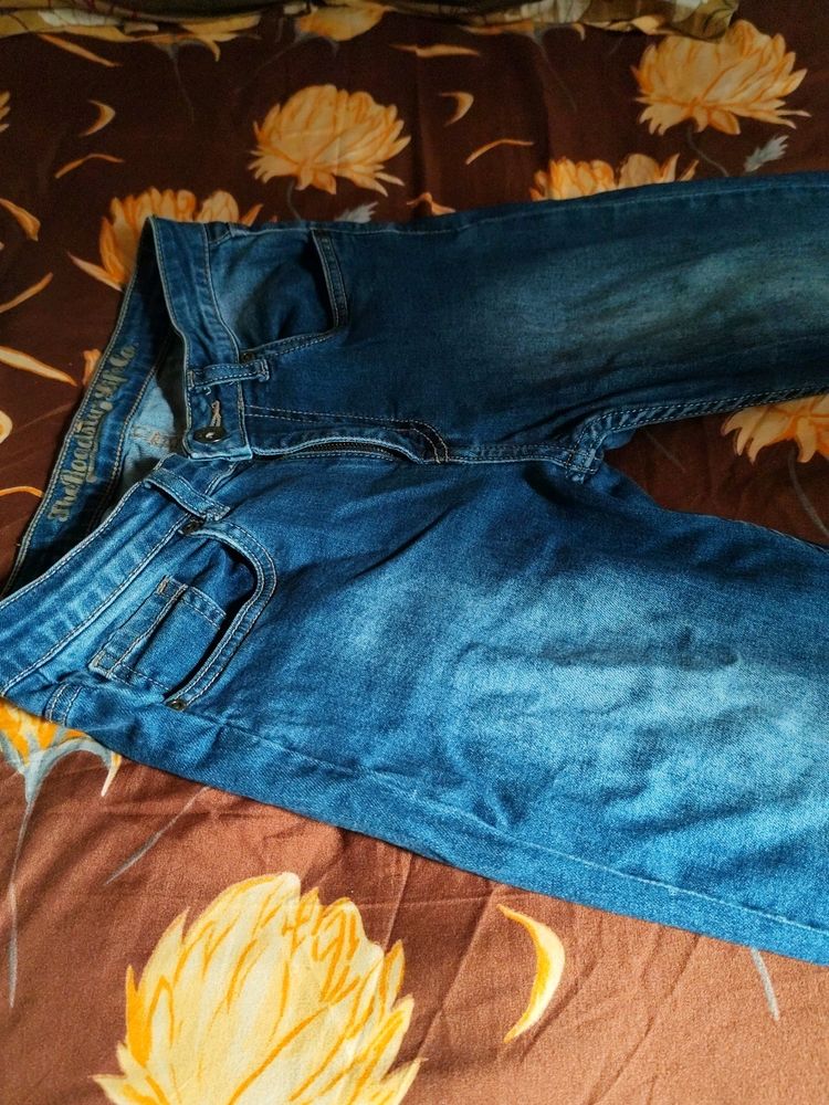 Washed Out Jeans With Obvious Flaws.