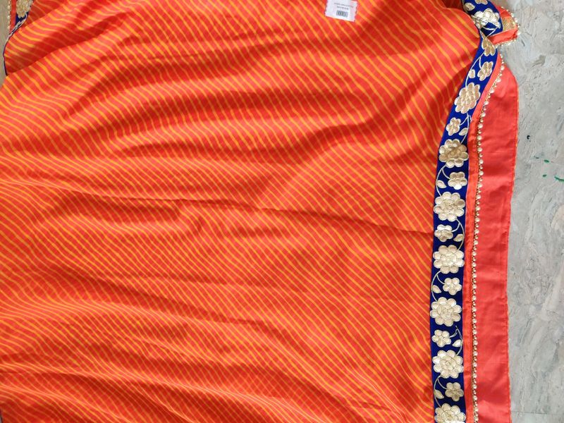 orange leheriya saree with velvet border