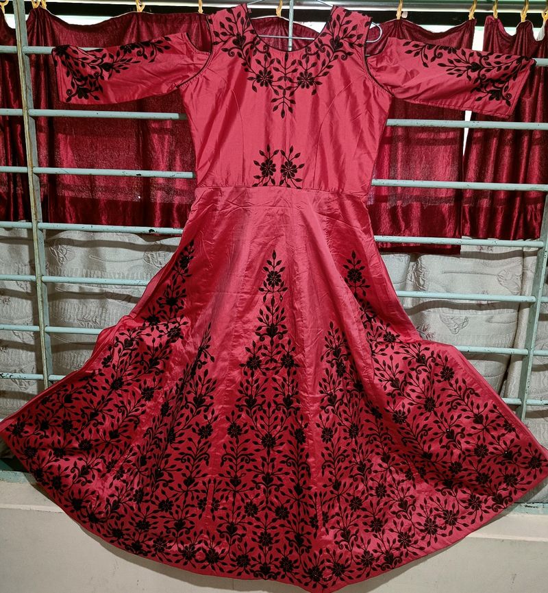 gown , red base with black embroidery