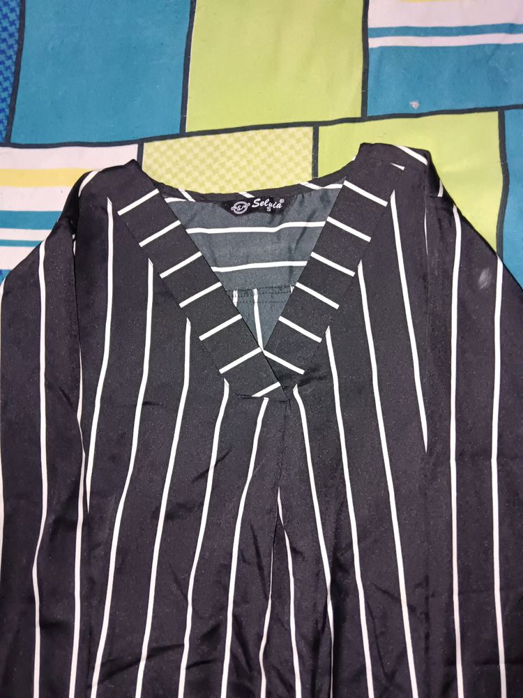 A White  Lined Top Over. Black Shirt