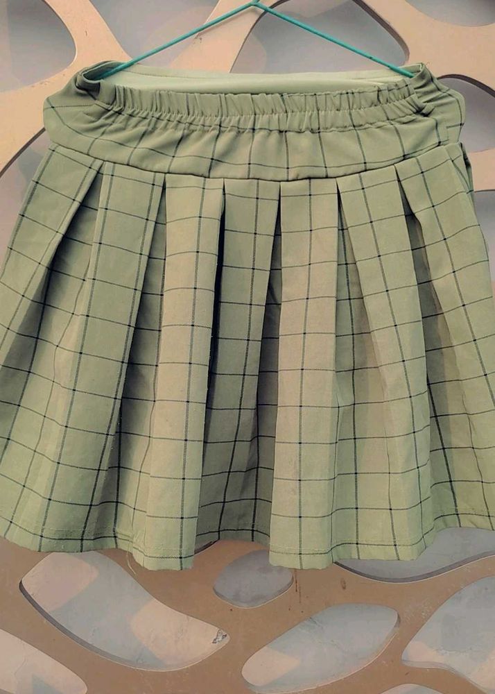 A beautiful korean style pleated skirt in oilive g