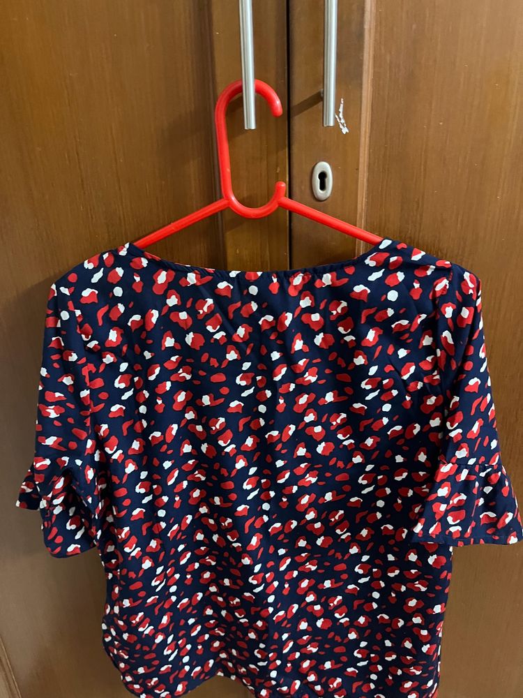 A Gently Used Crepe Top With Lovely Print