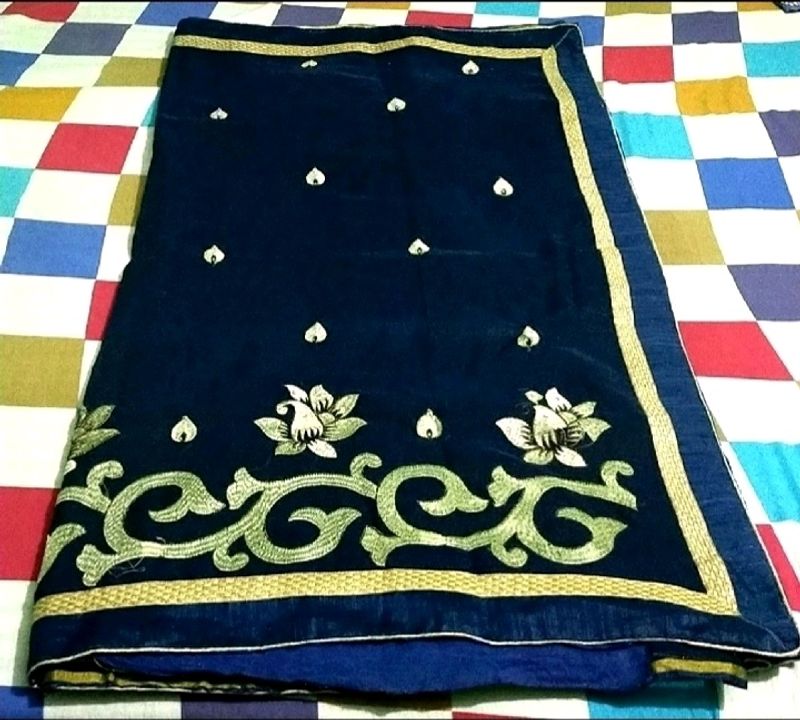 IT IS A NAVY BLUE WOMEN'S SAREE....