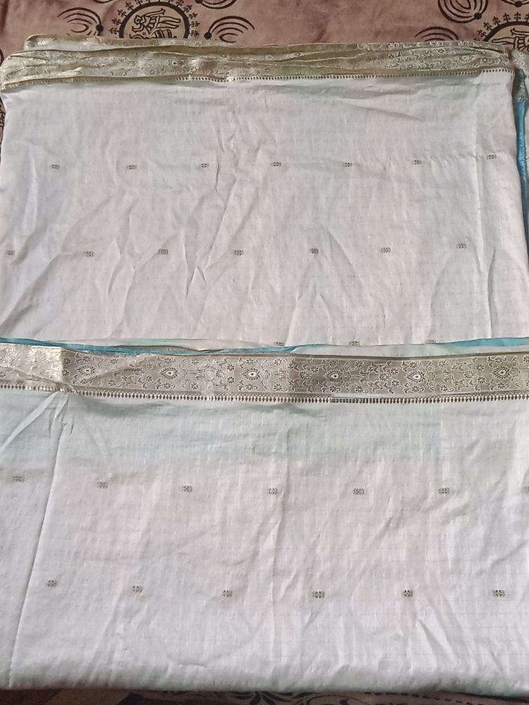 white banarasi silk saree with blue colour pallu