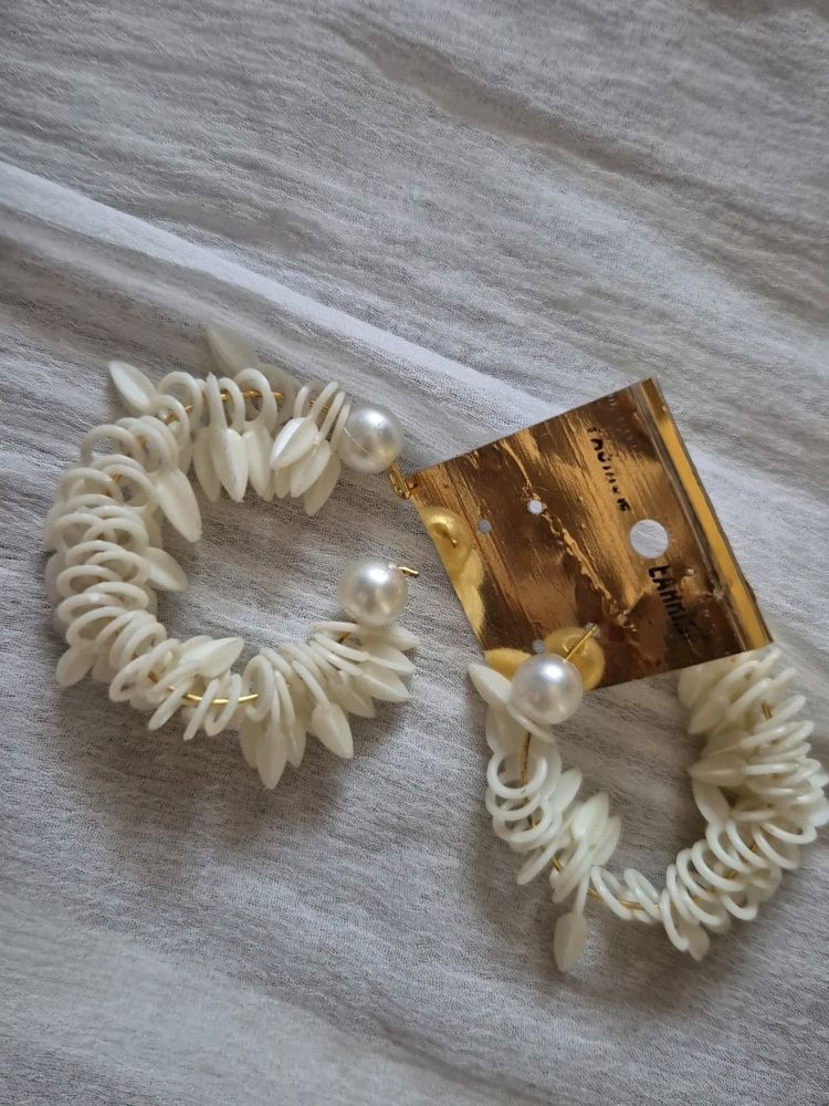 Off White Pearl Earnings