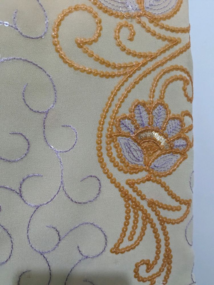 Cream And Orange Embroidery Saree