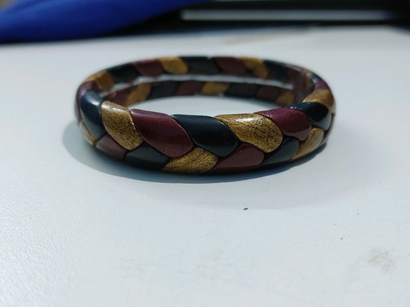 Red, gold, black braid bangle