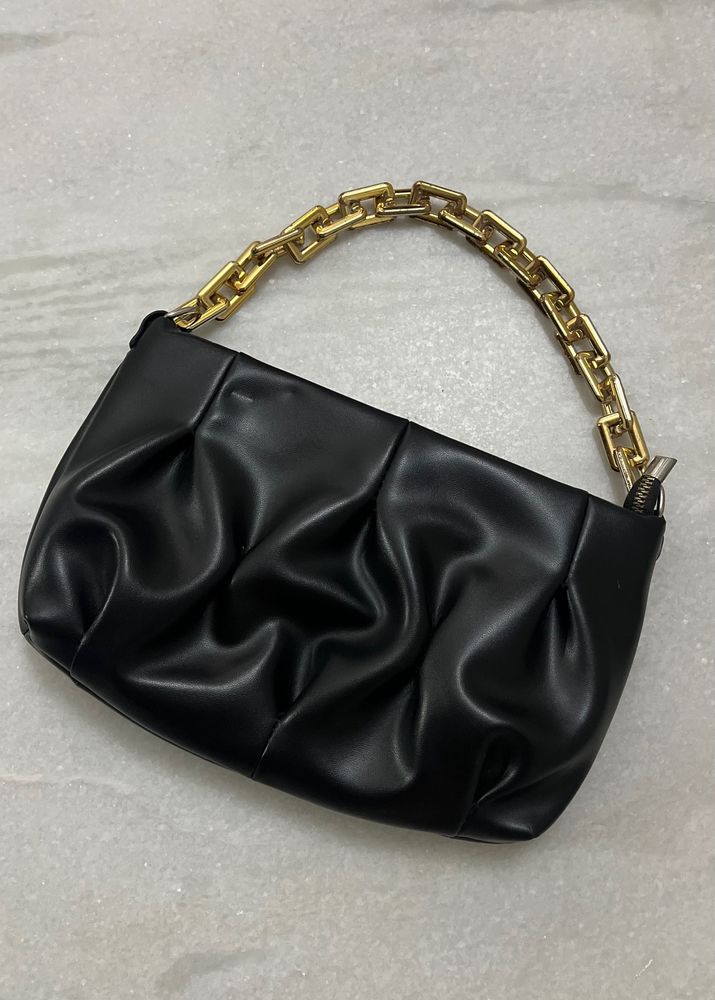 Black leather bag with gold chain strap