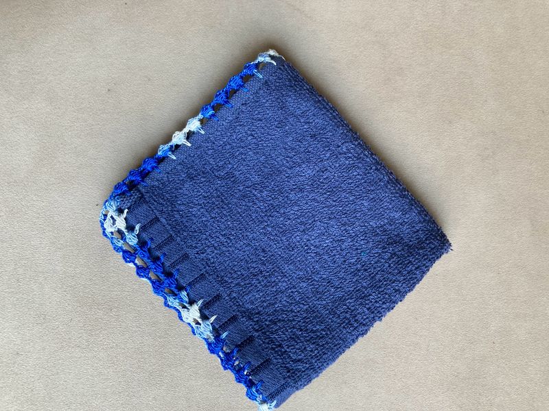 A Hand Napkin With Crochet Border