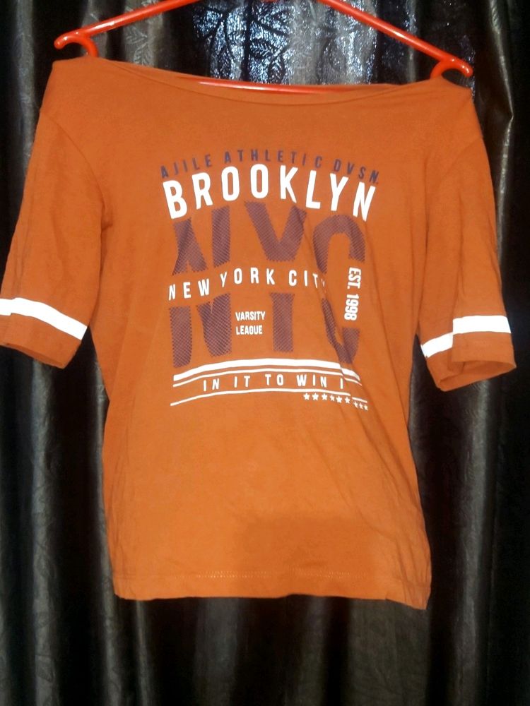 This A  Orange Colour Tshirt With Size S .