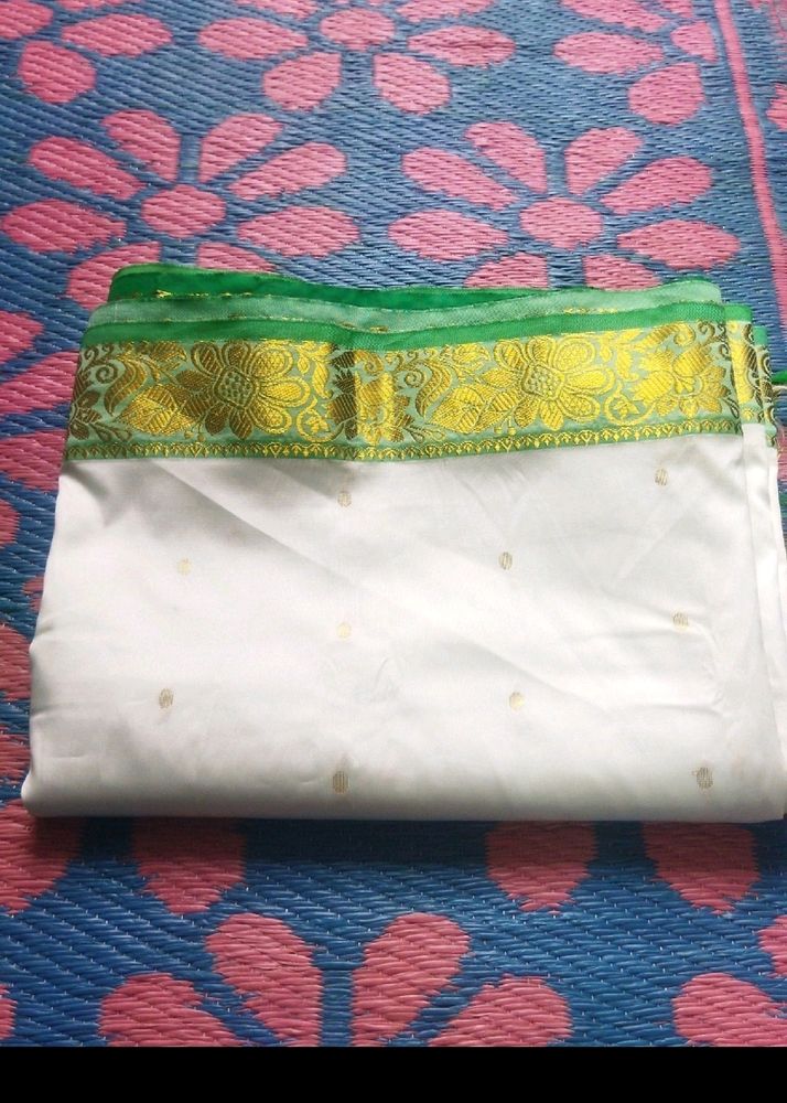 White Saree With Green And Golden Design