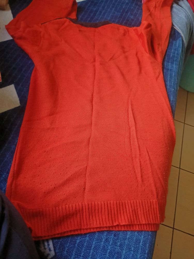 Orange Sweater With Black Print  . Lightly Lint On This