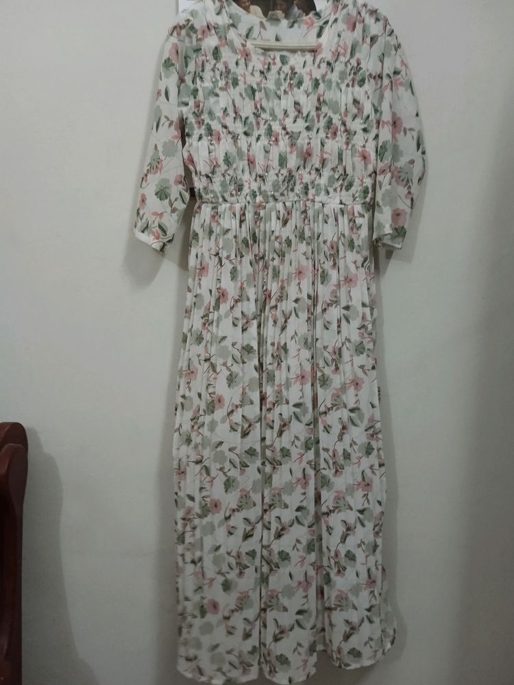 White Colour Printed Frill Type Gown. Eacy To Wear The Front Portion Is Frill Type And White Beeds Work Is Very Beautiful. Frill And Elastic Work So Medium And Xl Type People Can By. .