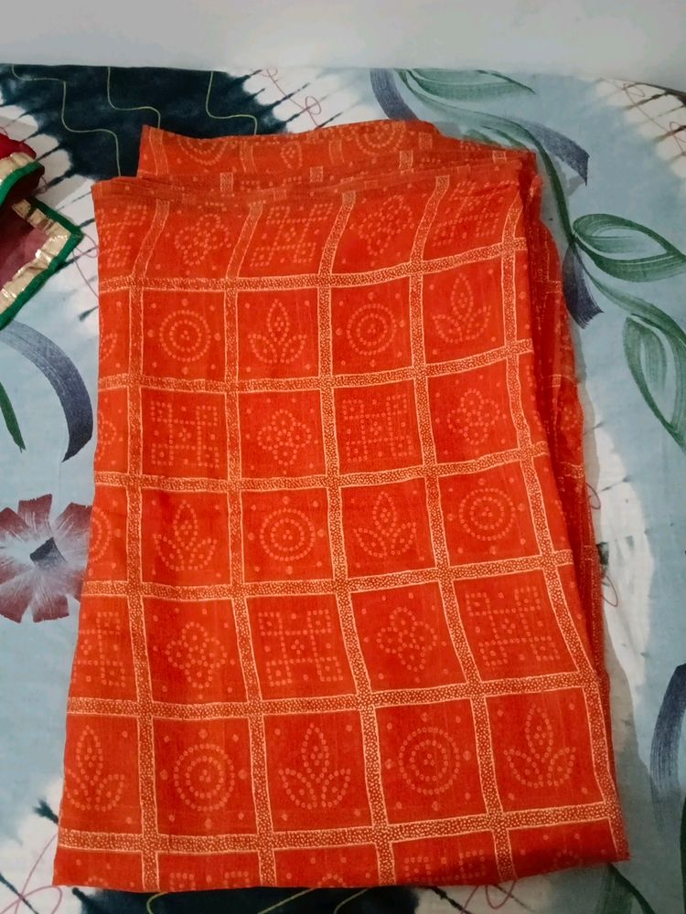 orange saree with bandhej print