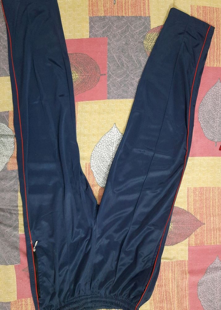 Navy Blue Lower or Traking pants with chain detailing pockets at front and back. elasticated and also have drawstrings on the waist